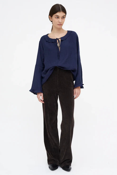 Top fluido con volantes azul